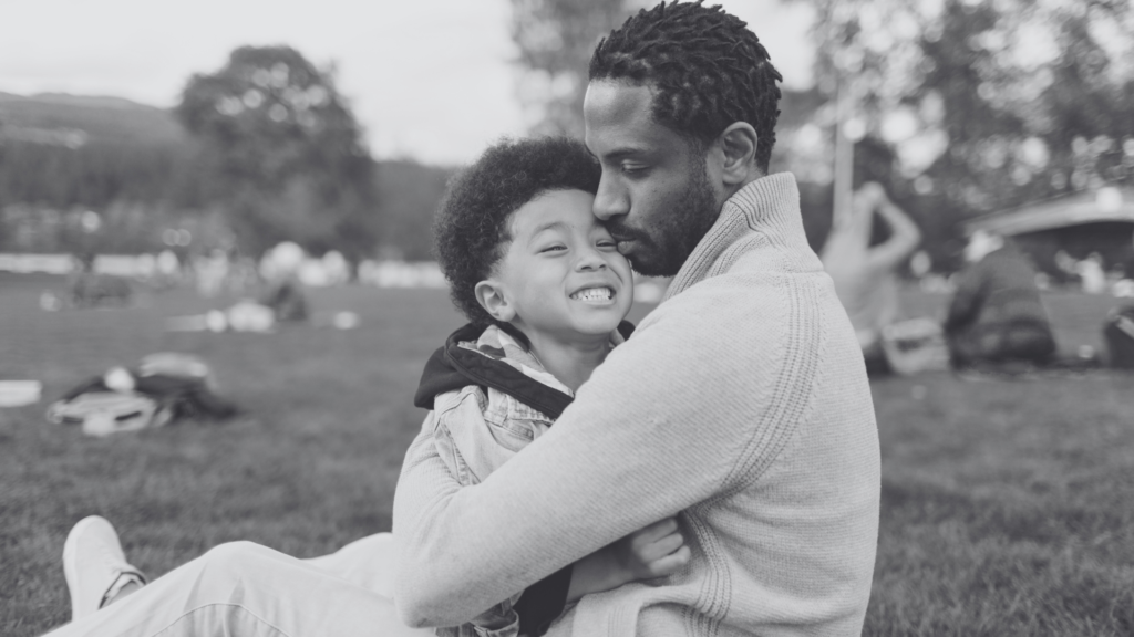 dad hugging son - national blessing day